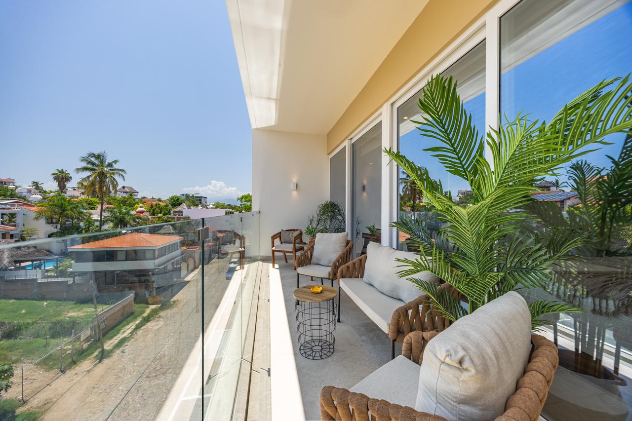 Wide balcony seating area at Casa Nayah