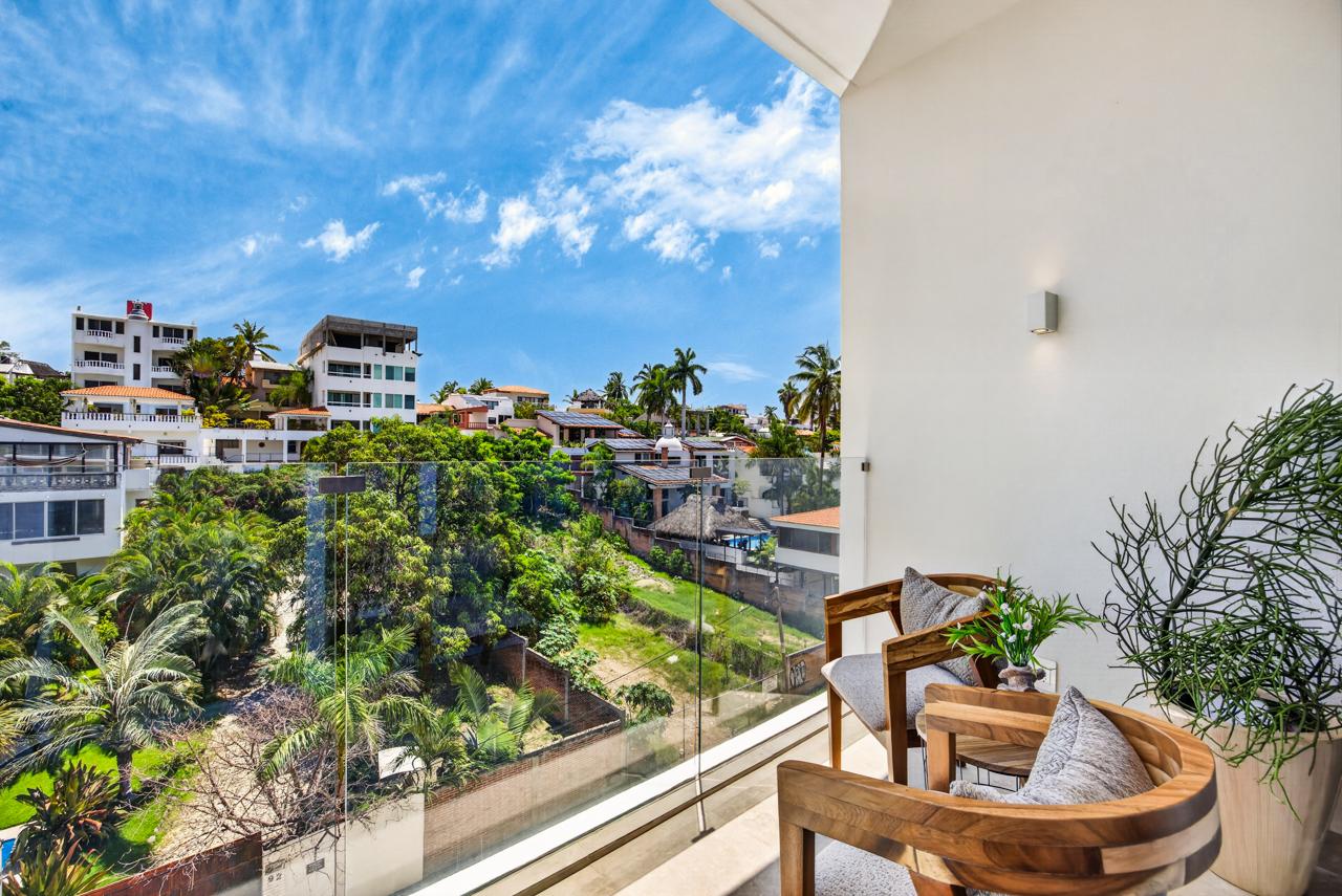 Balcony overlooking lush jungle and Bucerías rooftops