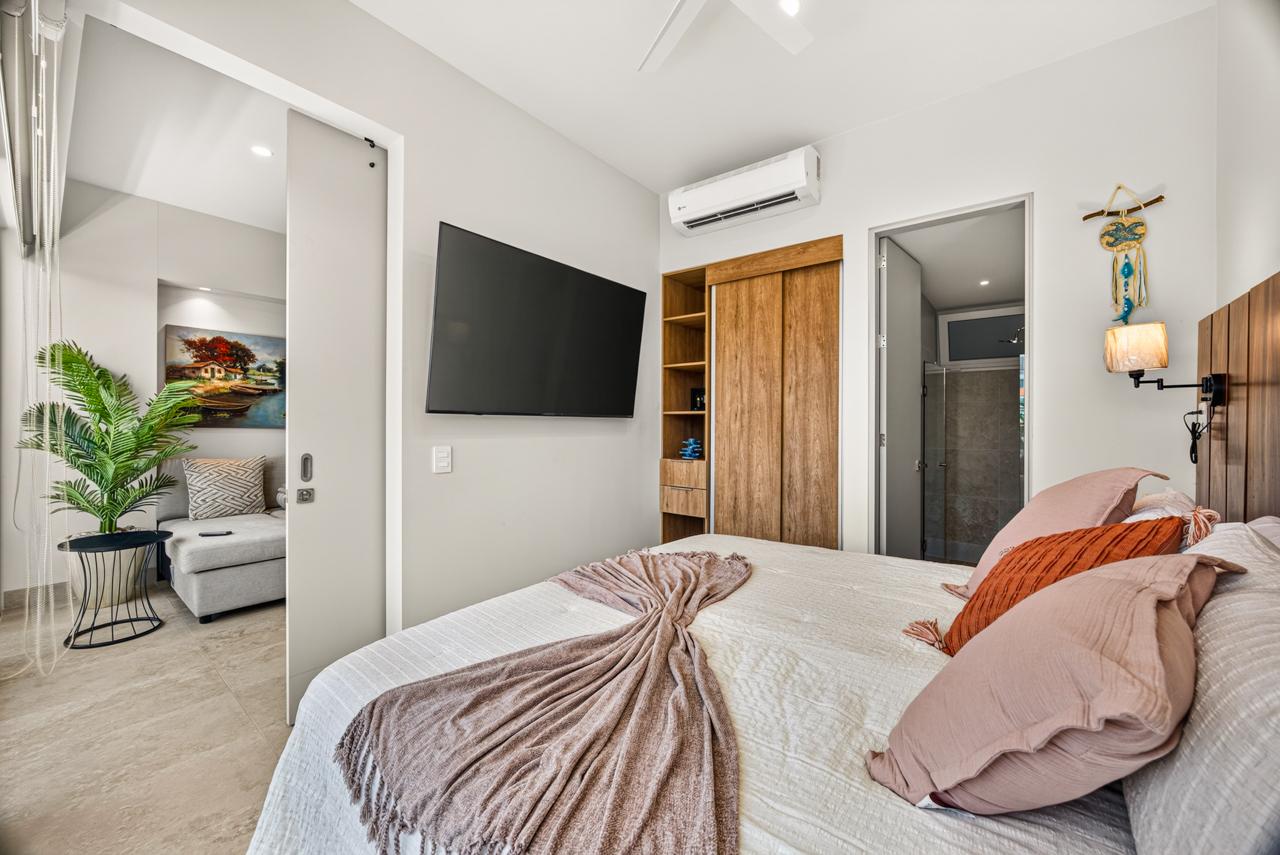 Bedroom with pocket door open to the living room